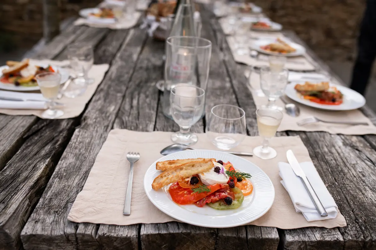 A plated dish on an old weathered table